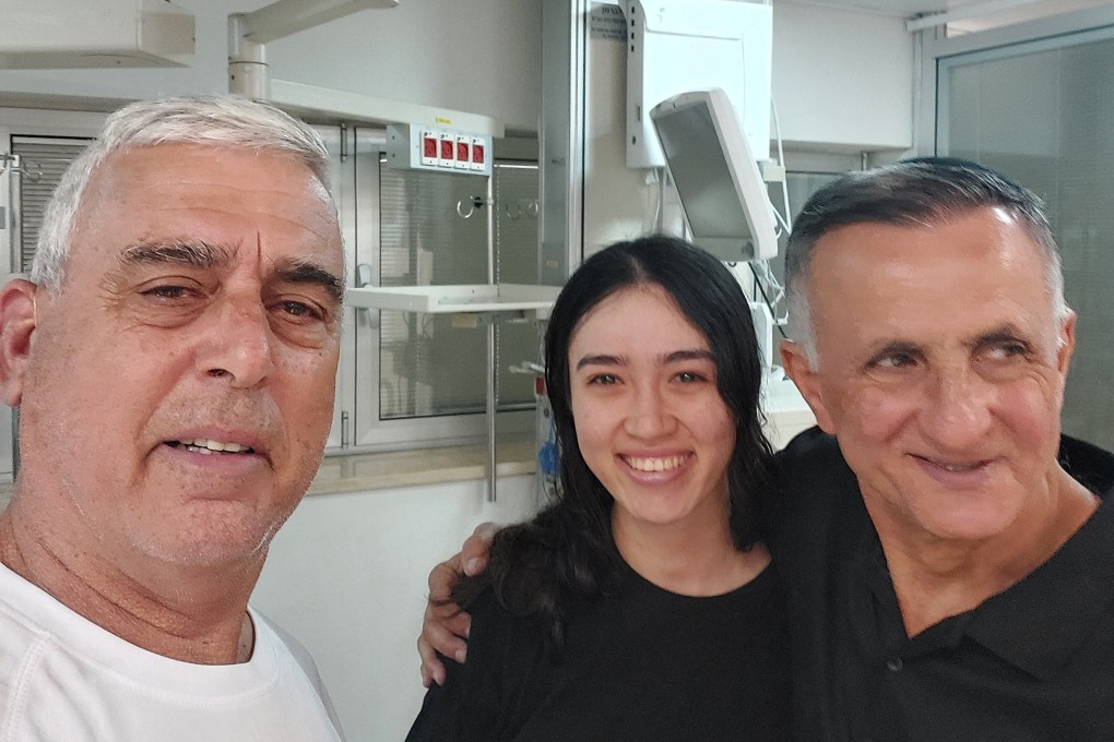 Noa Argamani, a rescued hostage, stands with her father Yakov and a family friend Nir Givon, after Israeli forces rescued four hostages alive from the central Gaza Strip, at Sheba Medical Center, in Ramat Gan, Israel, on Saturday. Photo: Nir Givon/Handout via Reuters