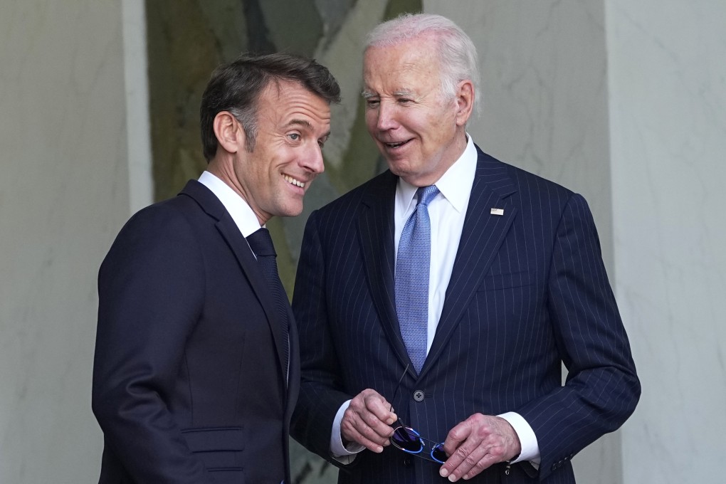 US President Joe Biden (right) smiles with French President Emmanuel Macron after their talks at the Elysee Palace in Paris on Saturday. Photo: AP