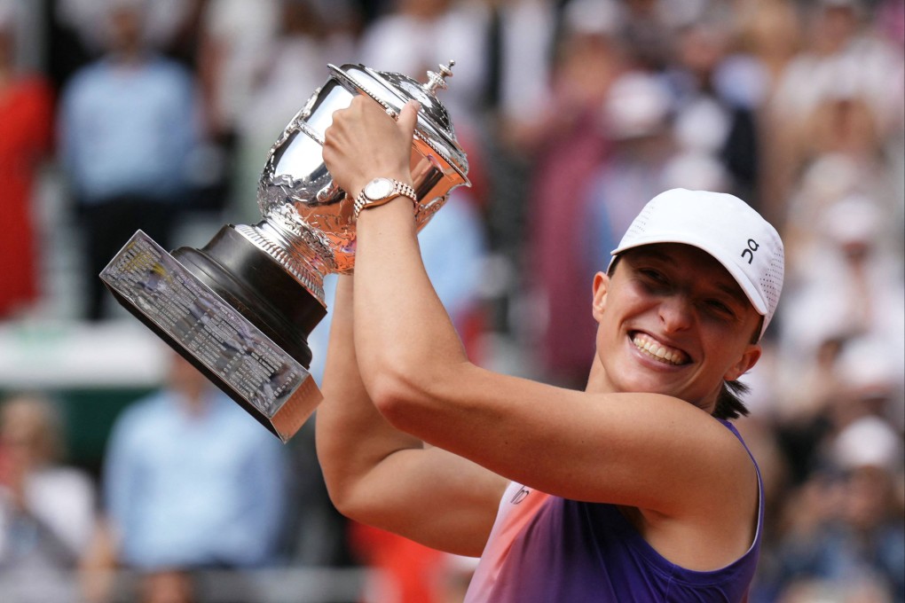 Poland’s Iga Swiatek celebrates with the trophy after winning against Italy’s Jasmine Paolini. Photo: AFP