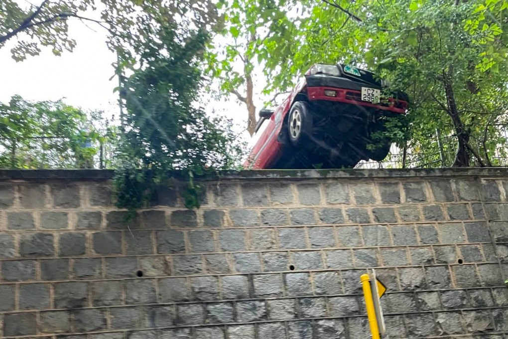 The front half of the taxi was left hanging over Ice House Street. Photo: Facebook/Bosco Chu