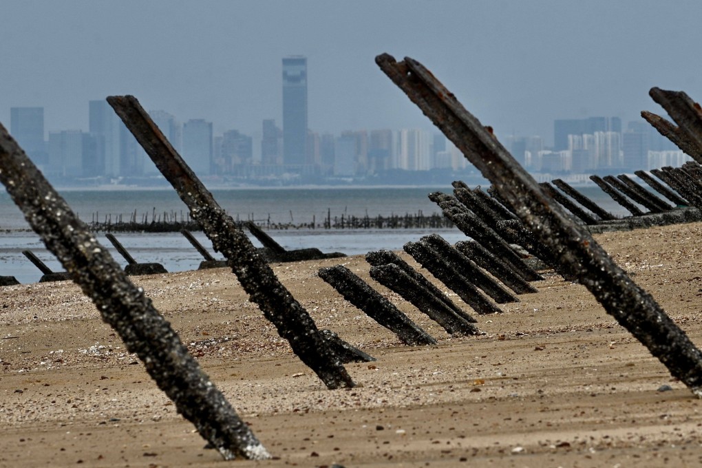 Anti-landing spikes are seen along the coast of Quemoy, with mainland China in the background. Photo: AFP