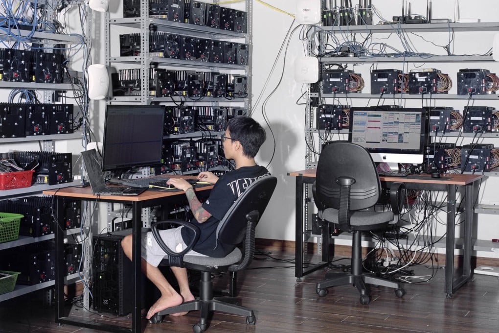 A click farmer at work in Vietnam. Click farms can employ thousands of devices to manipulate how popular online content or products appear. They operate in several places, including Hong Kong. Photo: Jack Latham