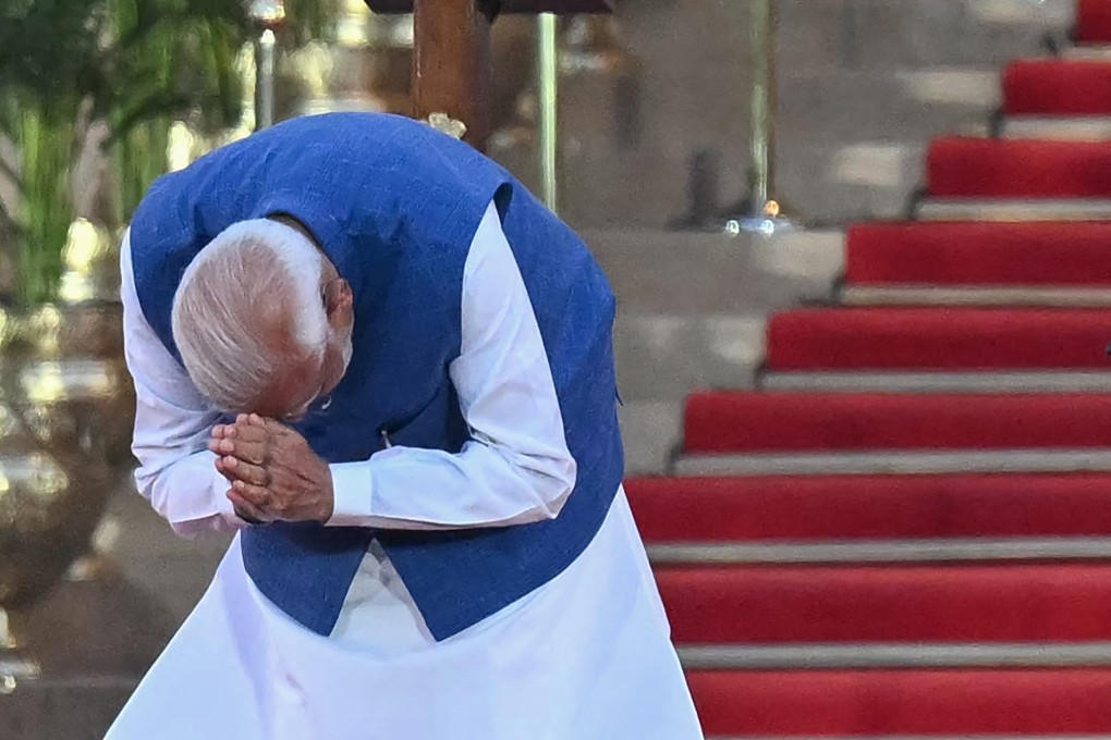 India’s Narendra Modi gestures to the gathering before taking the oath of office for his third term. Photo: AFP