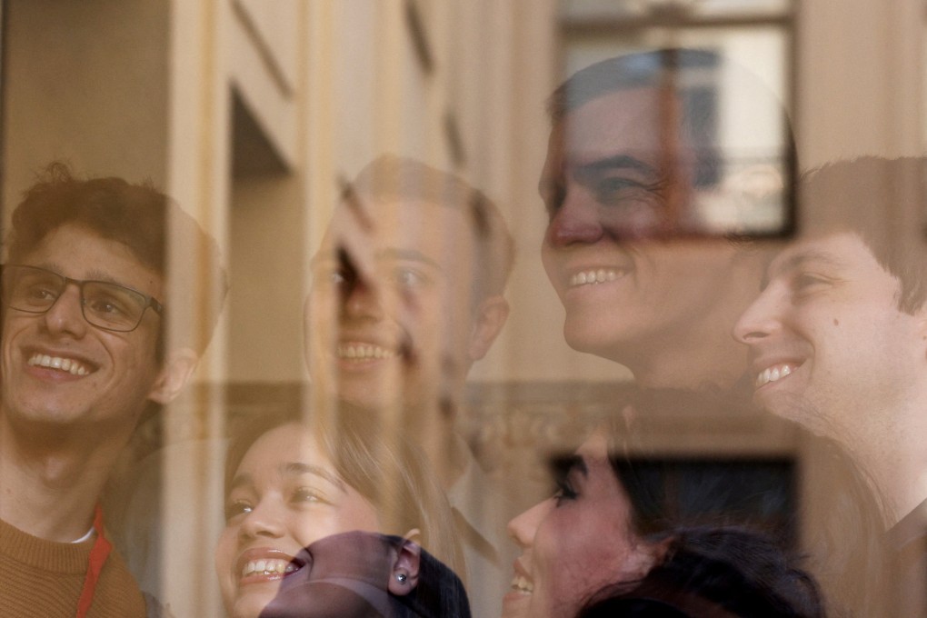 Spain’s Prime Minister Pedro Sanchez poses for a picture with supporters at a polling station. Photo: Reuters