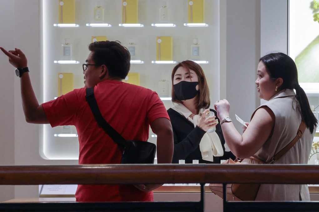 Store staff serving customers at a shopping centre in Tsim Sha Tsui on June 4. Hong Kong retailers have been struggling as local shoppers flock to the mainland for bargains while mainlanders are turning to Hainan as their top luxury shopping destination. Photo: Jelly Tse
