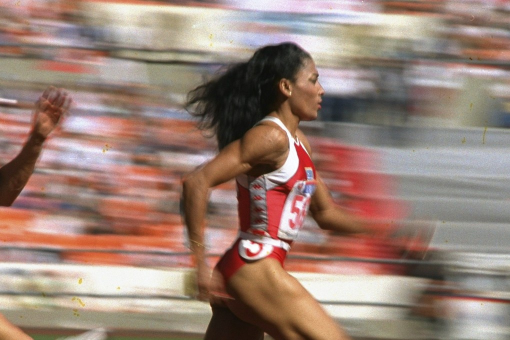 US sprinter Florence Griffith Joyner strides to a world record in a semifinal heat of the Olympic women’s 200 metres in Seoul in 1988. Photo: AP