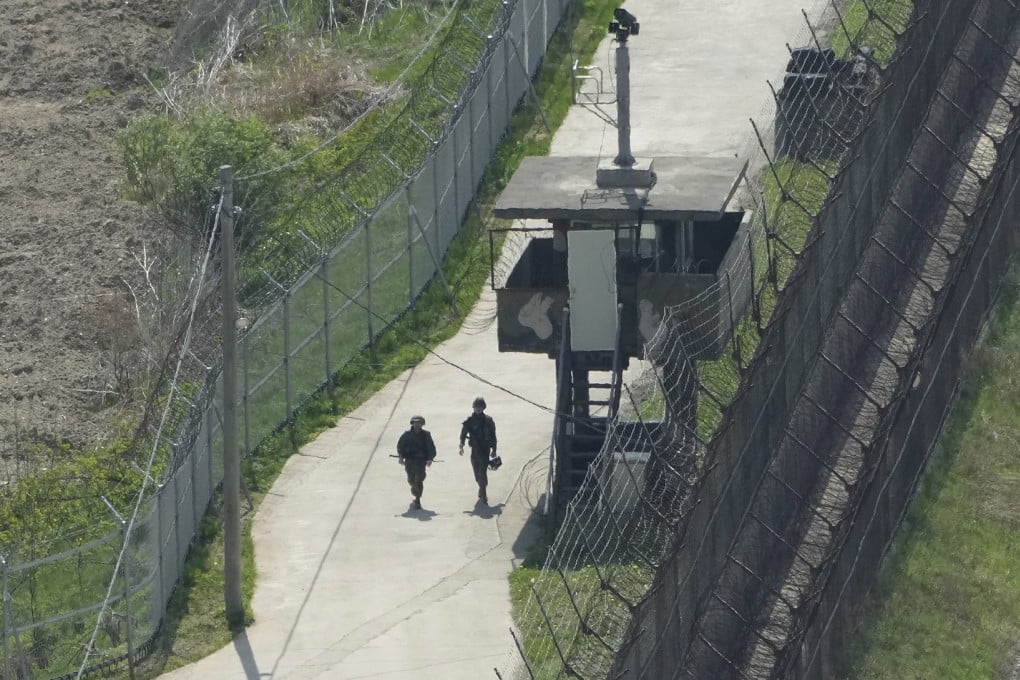 South Korean soldiers patrol along a barbed-wire fence in Paju, near the border with North Korea. Photo: AP