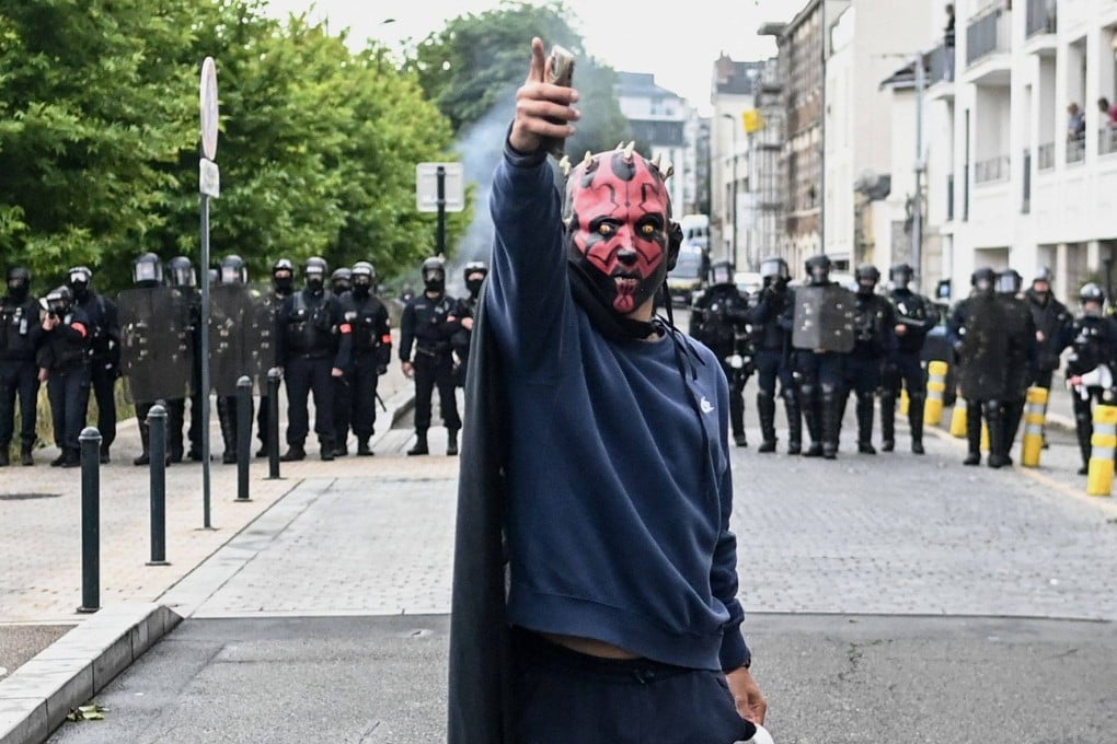 A protestor in Nantes, western France demonstrates against the far-right National Rally party after their success in the European elections. Photo: AFP