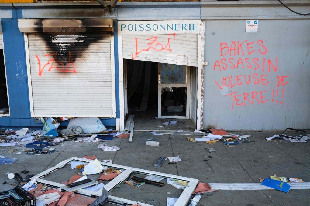 A destroyed shop is seen in Noumea. France suspended a planned electoral reform in its overseas territory of New Caledonia, which triggered civil unrest. Photo: AFP