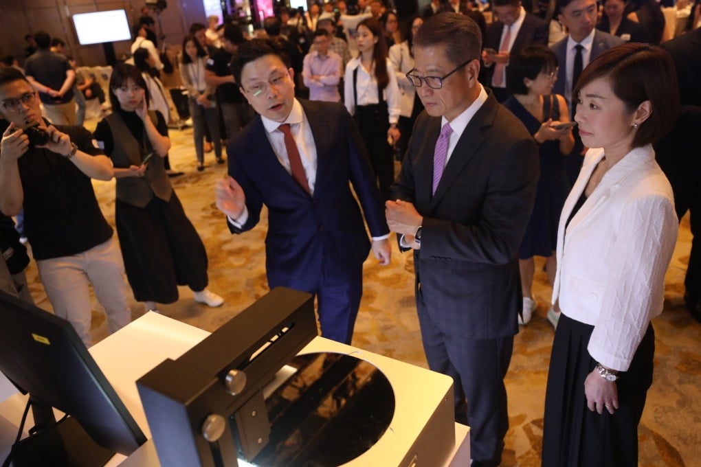 From left to right, SmartMore founder Jiaya Jia, Financial Secretary Paul Chan Mo-Po , and HKIC CEO Clara Chan Ka-chai. Photo: Sun Yeung