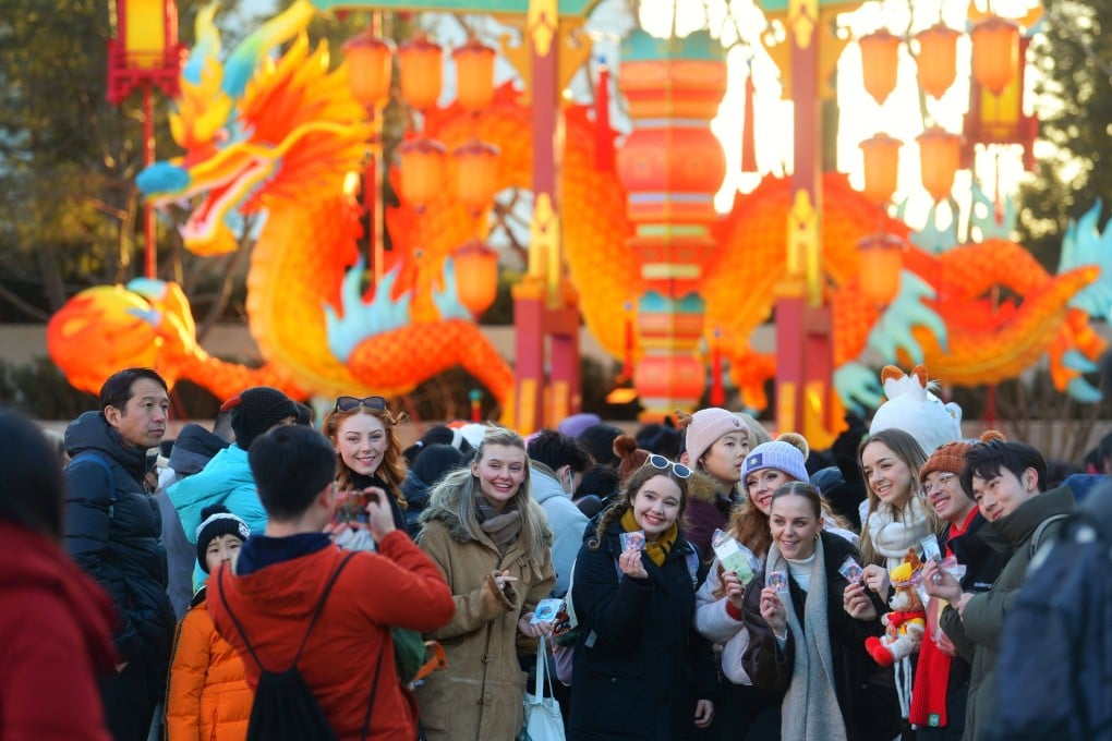 Tourists pose for a photo at Universal Beijing Resort in January. An attack on four US college instructors at a northeastern China park comes amid heightened US-China geopolitical tensions. Photo: Getty Images