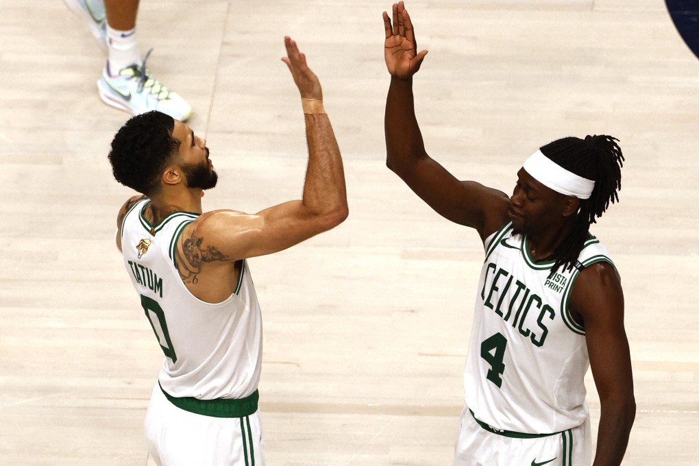 Boston Celtics stars Jayson Tatum (0) and guard Jrue Holiday (4) celebrate after defeat of Dallas Mavericks. Photo: Reuters