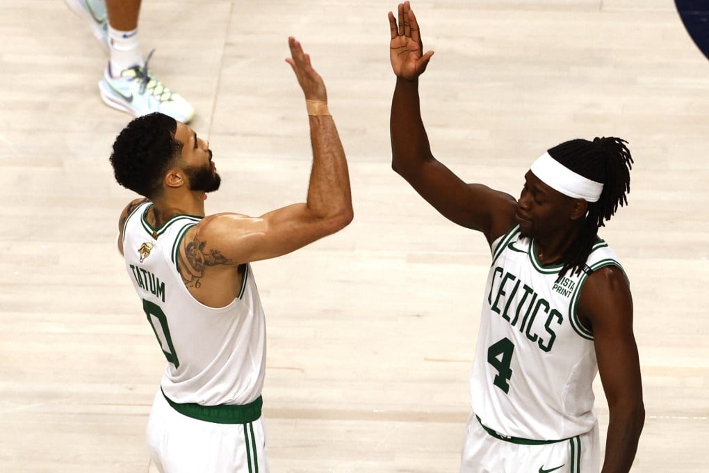 Boston Celtics stars Jayson Tatum (0) and guard Jrue Holiday (4) celebrate after defeat of Dallas Mavericks. Photo: Reuters