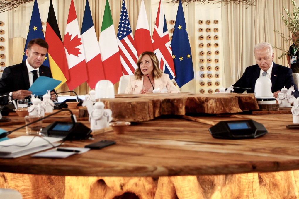 From left:French President Emmanuel Macron, Italian Prime Minister Giorgia Meloni and US President Joe Biden attend a round table meeting at the G7 summit in Borgo Egnazia, Italy on Thursday. Photo: EPA-EFE