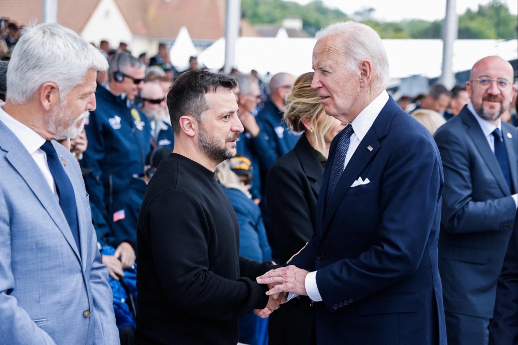 US President Joe Biden (right) shakes hands with Ukraine’s President Volodymyr Zelensky in Normandy, France, on June 6. Photo: AFP