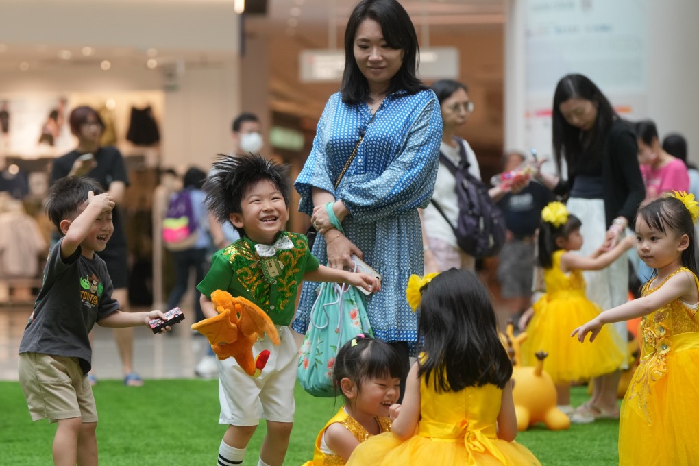 Children play in an open area at Olympian City at Tai Kok Tsui. The online poll of 4,529 residents was aimed at gauging the happiness level of families in the post-pandemic era. Photo: Sam Tsang