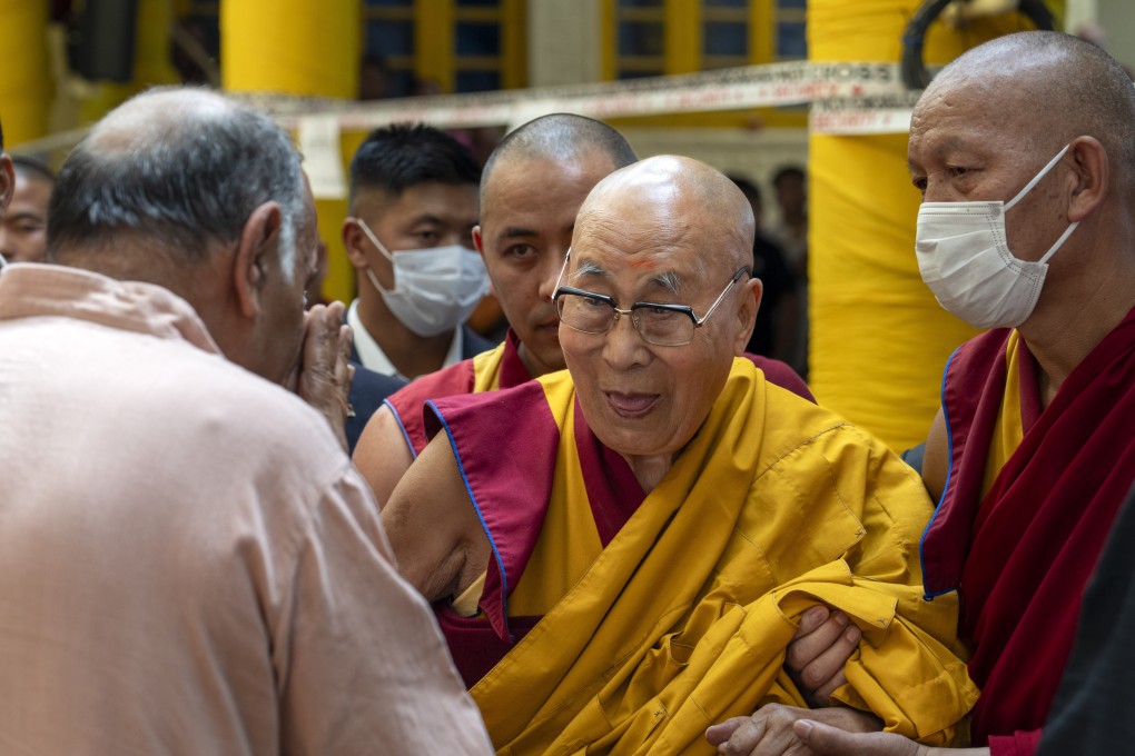 Tibetan spiritual leader the Dalai Lama (centre) greets a guest at the Tsuglakhang temple in Dharamshala, India, on Tuesday. Photo: AP
