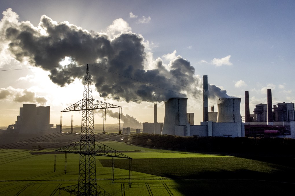 Steam rises from the coal-fired power plant. Singapore is offering refiners and petrochemical companies rebates to help ease costs and remain competitive. Photo: AP/File