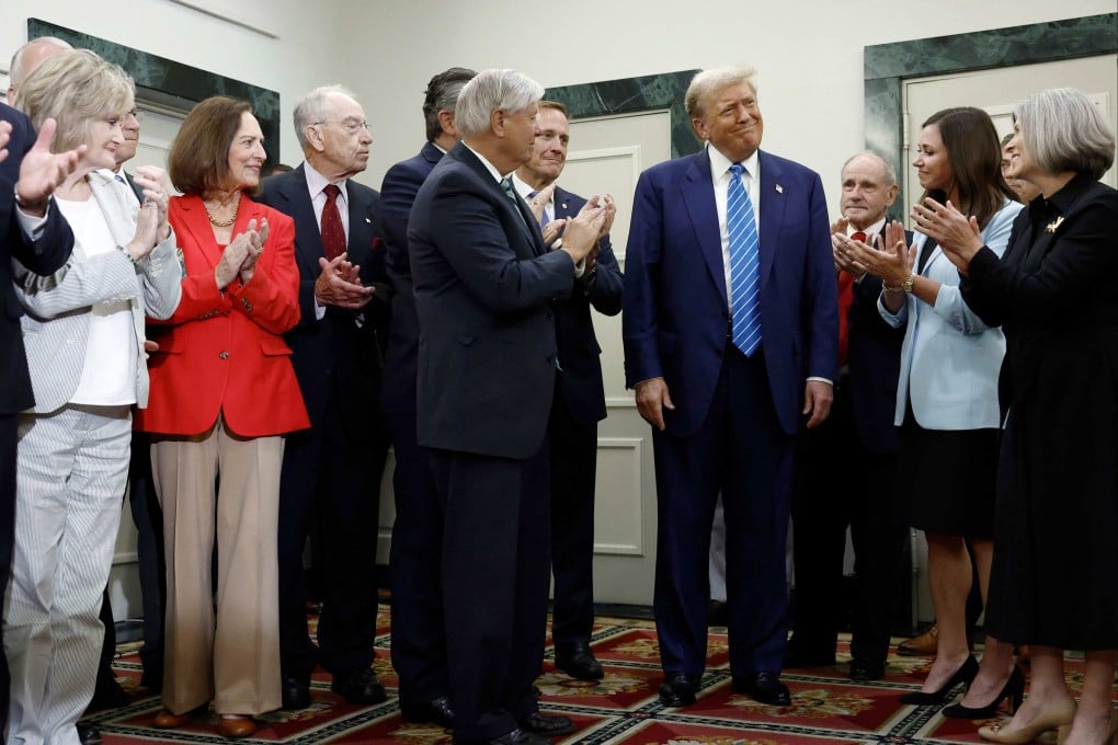 Donald Trump being applauded by Senate Republicans in Washington on Thursday. Photo: AFP