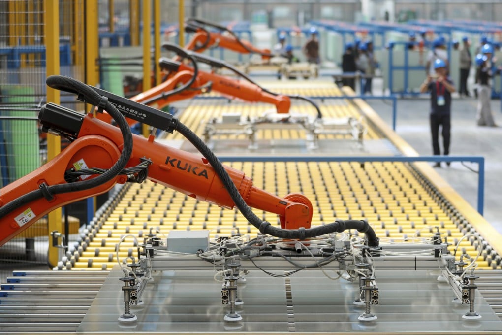 Kuka robots work on the production line of flat glass for solar panels at a subsidiary plant of Hoshine Silicon Industry in northwestern China’s Xinjiang Uyghur Autonomous Region. China’s statistics bureau is due to announce industrial production, retail sales and fixed-asset investment data for May on Monday Photo: AP
