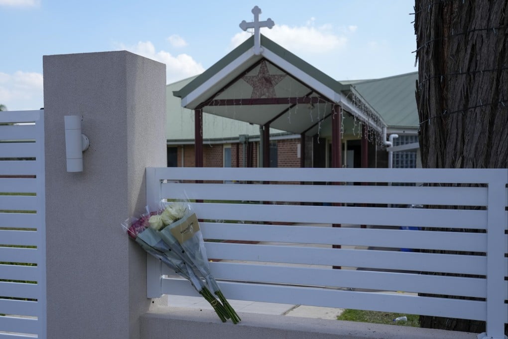 Flowers sit on a fence outside the Christ the Good Shepherd church in suburban Wakely in western Sydney, Australia. Photo: AP