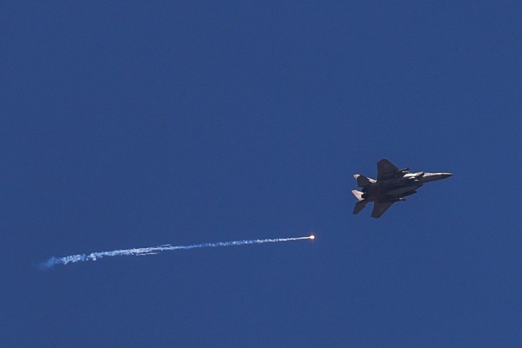 An Israeli warplane flies over the Israel-Lebanon border amid ongoing hostilities between Hezbollah and Israeli forces. Photo: Reuters