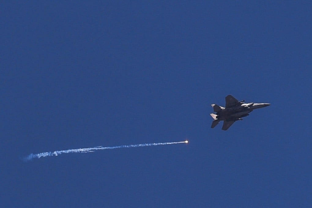 An Israeli warplane flies over the Israel-Lebanon border amid ongoing hostilities between Hezbollah and Israeli forces. Photo: Reuters