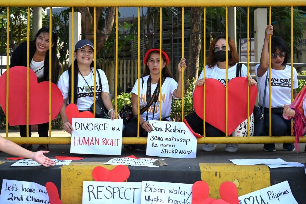 Pro-divorce protesters taking part in a demonstration on Valentine’s Day in 2023 in front of the Senate Building in Pasay, Metro Manila, the Philippines. Photo: AFP