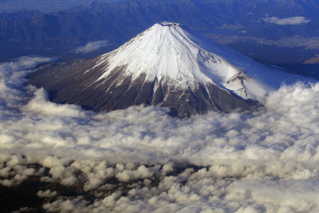 Mount Fuji, Japan’s highest peak at 3,776-metres tall, as seen from an airplane window. Photo: AP