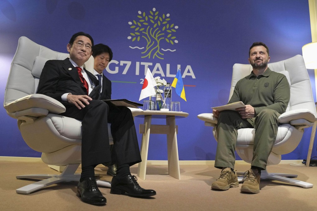 Japanese Prime Minister Fumio Kishida (left) and Ukrainian President Volodymyr Zelensky speak on the sidelines of the G7 summit in the southern Italian city of Fasano in Puglia. Photo: Kyodo