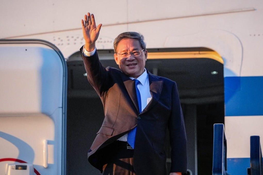 China’s Premier Li Qiang waves as he arrives at Adelaide Airport. Photo: AFP
