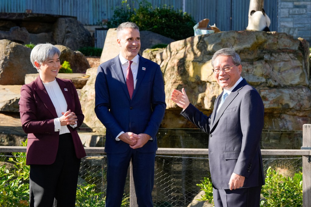 Australia’s Foreign Minister Penny Wong (left) and South Australian Premier Peter Malinauskas (centre) look on as China’s Premier Li Qiang reacts in front of the panda enclosure at Adelaide Zoo on Sunday. Photo: Reuters