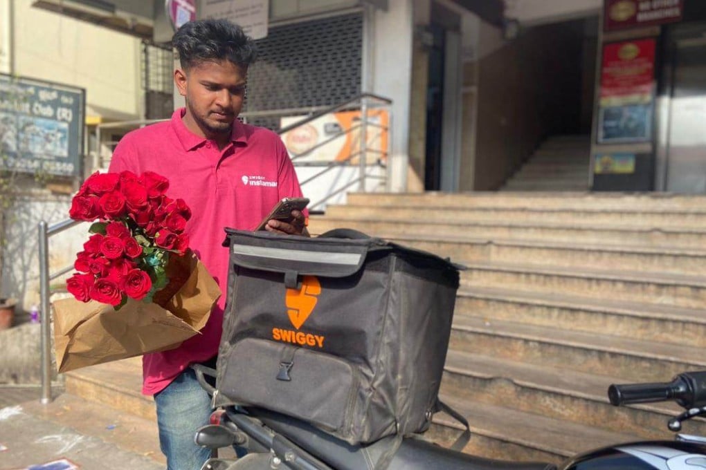 A Swiggy driver with flowers for his next delivery. Swiggy, which began as a food delivery aggregator and launched Instamart in 2020, was a pioneer of India’s quick-commerce industry. Photo: Handout