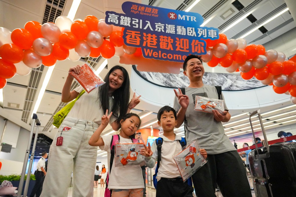 Ren Zhengyi (left) and her family arrive in Hong Kong on the first high-speed sleeper train from Shanghai. Photo: May Tse