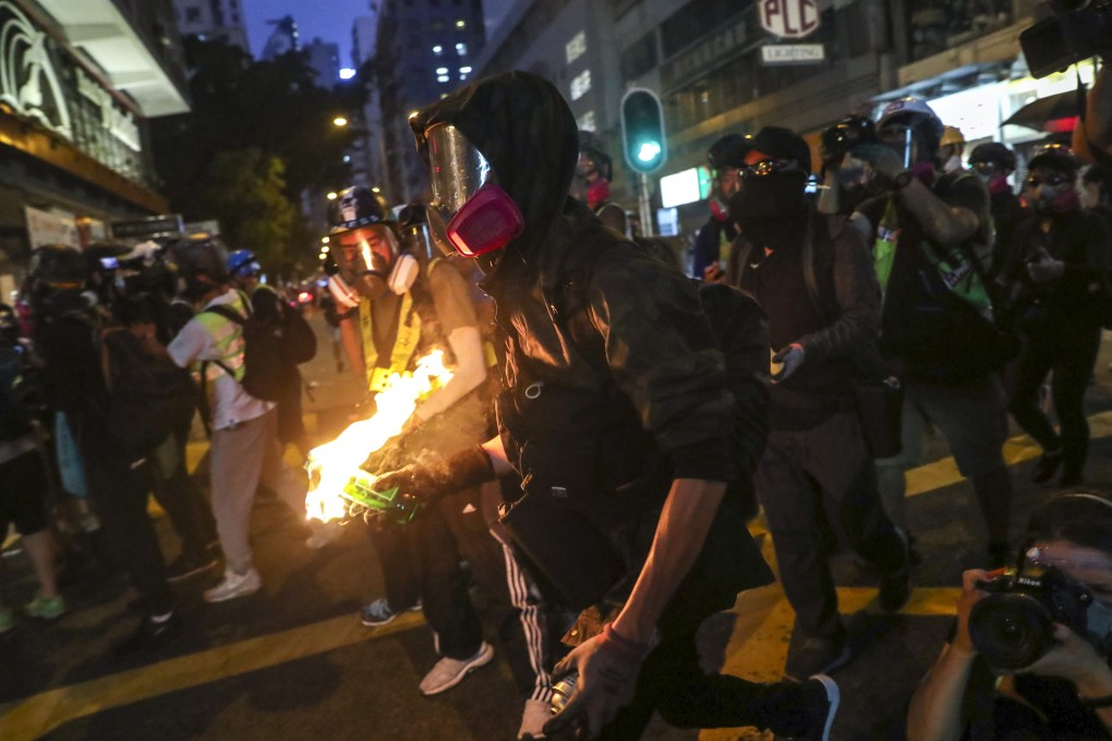 Protesters throw petrol bombs at police on Lockhart Road and Fleming Road in 2019. Photo: Sam Tsang