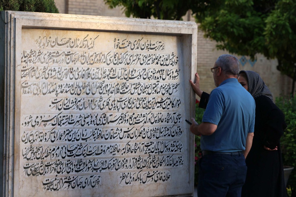 Iranians at the tomb of Persian poet Hafez, in Shiraz, Iran, where he lived and died in the 14th century. The bard’s works are a source of guidance for many in Iran, and are commonly used in fortune-telling. Photo: AFP