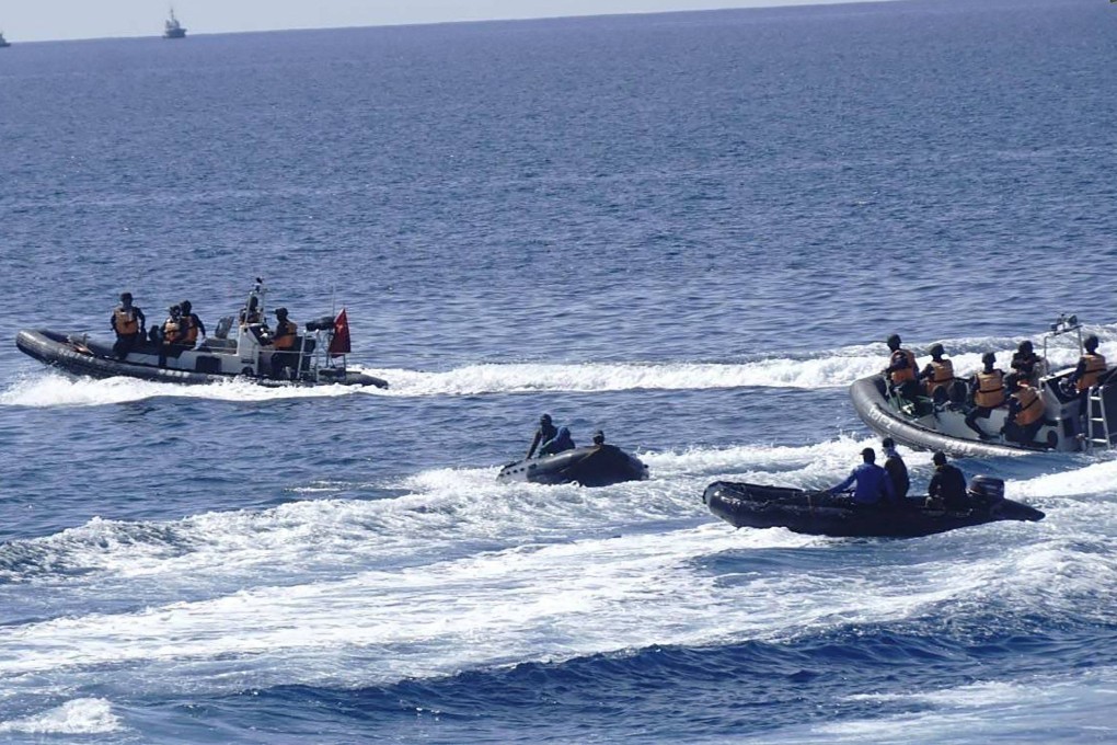 Two Chinese inflatable boats manoeuvring close to Philippine boats near the Philippine outpost at Second Thomas Shoal in disputed waters of the South China Sea on May 19. Photo: Handout