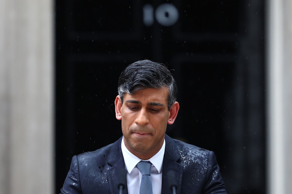 A rain-soaked Rishi Sunak announcing the UK election date last month. His party is expected lose by a wide margin. Photo: Reuters