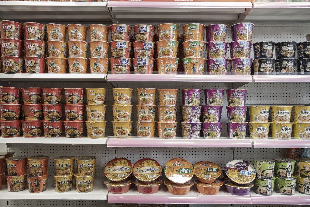 Various flavors of Tingyi Holding Corp. Master Kong branded instant noodles sit on shelves at the company’s headquarters in Shanghai, China. Photo: Bloomberg
