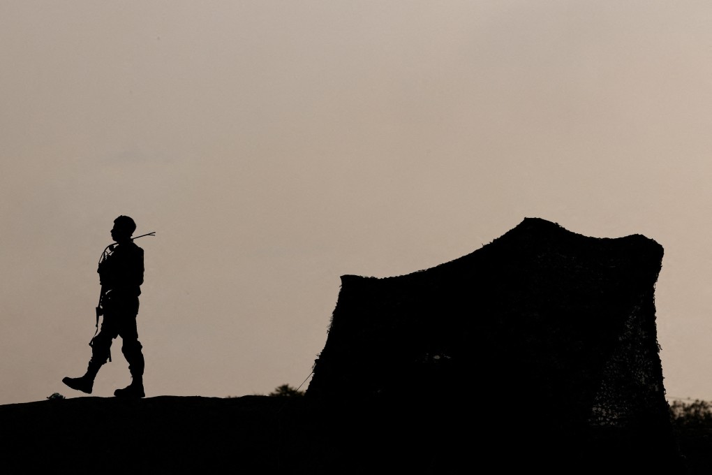 An Israeli soldier stands guard near the Israel-Gaza border. Photo: Reuters