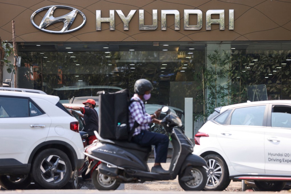 A man rides a scooter past a Hyundai dealership in Mumbai. South Korea’s Hyundai is the second-largest carmaker in India. Photo: Reuters