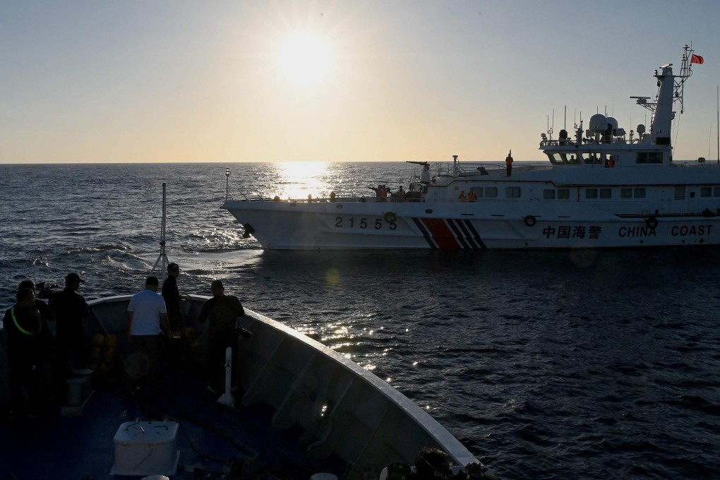 A China coastguard vessel sails in front of the BRP Sindangan of the Philippine coastguard during a supply mission to the Second Thomas Shoal in the disputed South China Sea. Photo: AFP