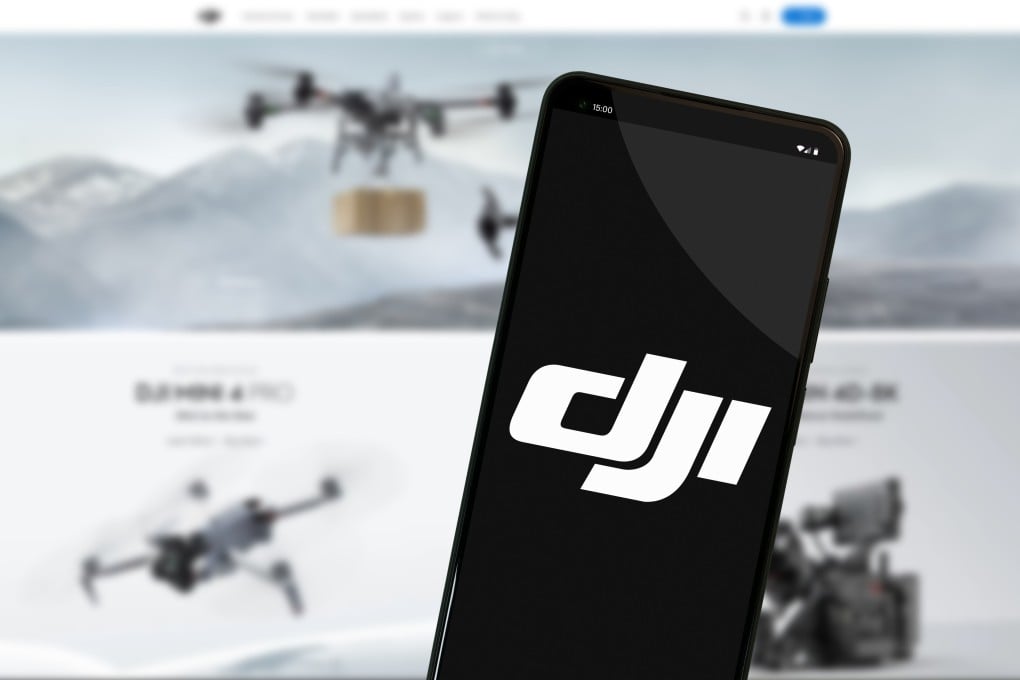 The DJI logo on a smartphone screen in front of the company’s website. Photo: Shutterstock Images