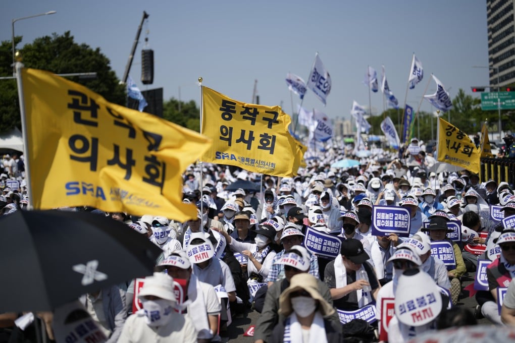 Members of the Korea Medical Association attend a rally in Seoul on Tuesday protesting against the government’s medical policy. Observers warn the months-long doctors’ strike may continue indefinitely. Photo: AP