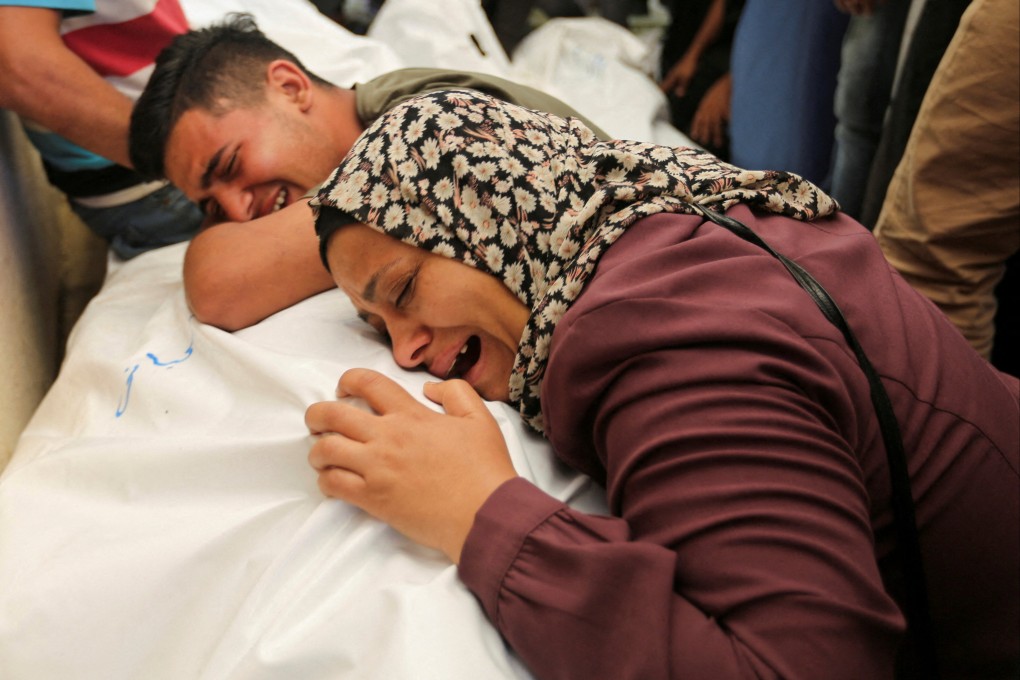 Mourners react next to the bodies of Palestinians, killed in Israeli strikes due to a military operation in Rafah. Photo: Reuters
