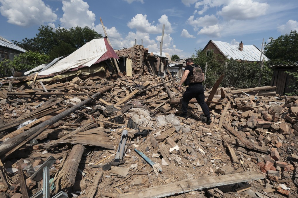 A police officer inspects the rubble of a building hit by Russian shelling in Orikhiv, near the front line in the Zaporizhzhia region of southeastern Ukraine, on June 10. Intense fighting has left parts of Ukraine in dire need of reconstruction, but any large-scale rebuilding likely will have to wait until the conflict ceases. Photo: EPA-EFE