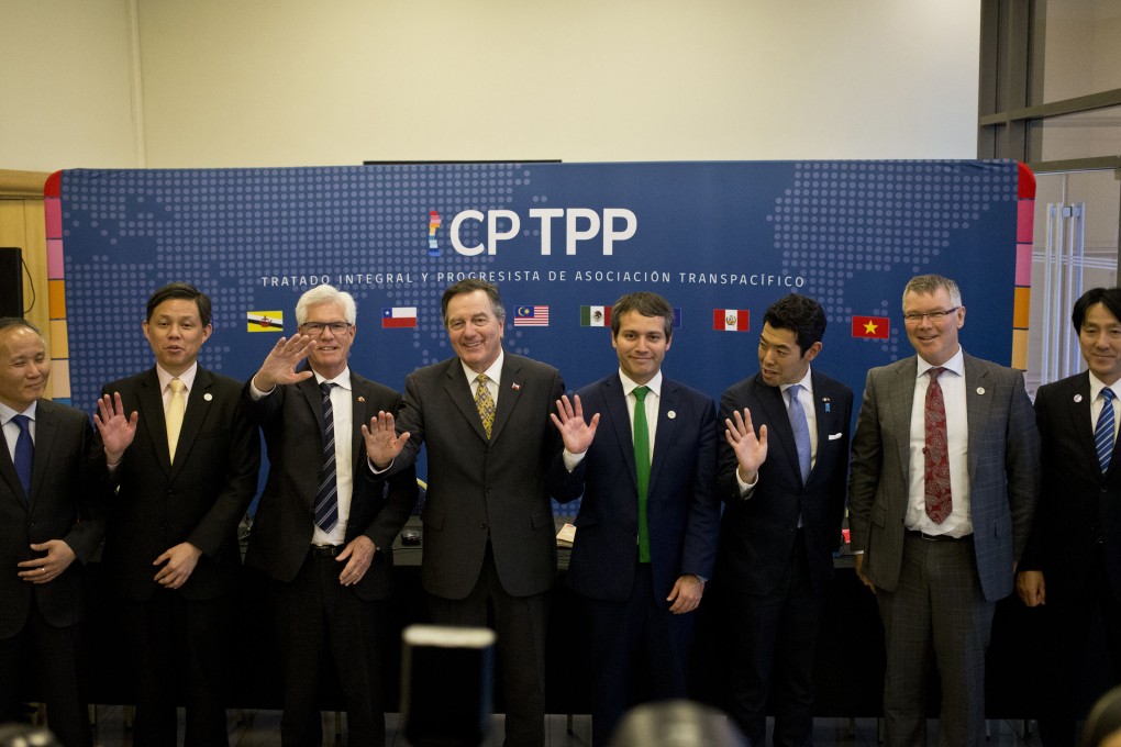 Officials from some of the nations in the Comprehensive and Progressive Agreement for Trans-Pacific Partnership pose for a group photo on May 16, 2019. A new book argues that the United States should join the alliance. Photo: AP