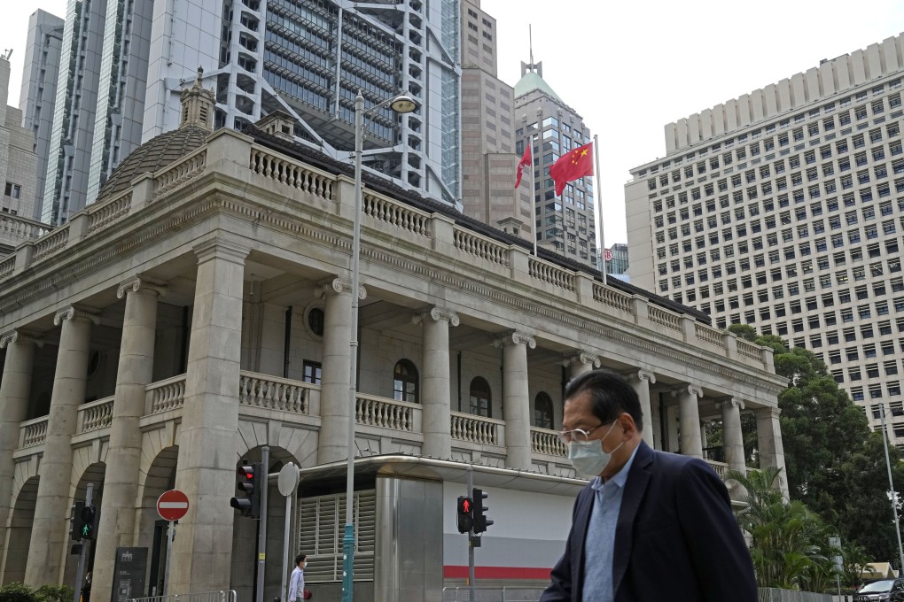 A pedestrian passes the Court of Final Appeal in Hong Kong in 2022. Two British judges have resigned from the city’s top court, and a Canadian judge is retiring. Photo: AP