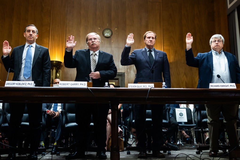 Testifying on Tuesday were, from left, Gregory Koblentz, associate professor and director of George Mason University’s Biodefence Graduate Program; Robert Garry, professor and associate dean in Tulane University’s School of Medicine; Steven Quay, CEO of Atossa Therapeutics and former faculty member at the Stanford University School of Medicine; and Richard Ebright, professor of chemical biology and laboratory director for Rutgers University’s Waksman Institute of Microbiology. Photo: EPA-EFE