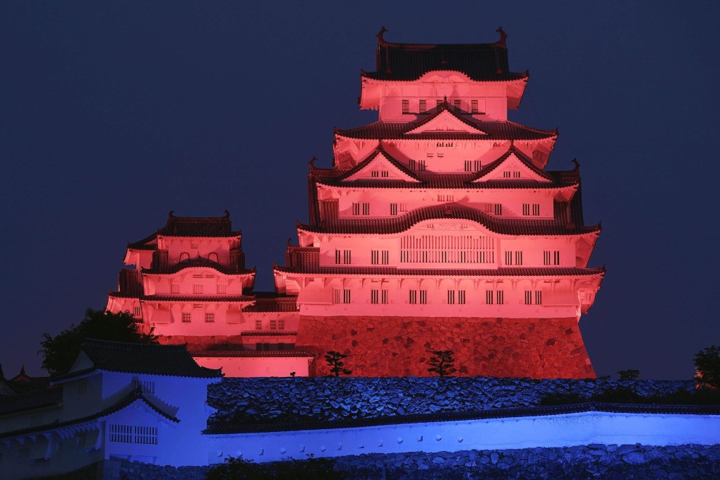 The World Heritage-listed Himeji Castle, in Hyogo prefecture, western Japan, is seen lit up in red and blue on Monday. Photo: Kyodo